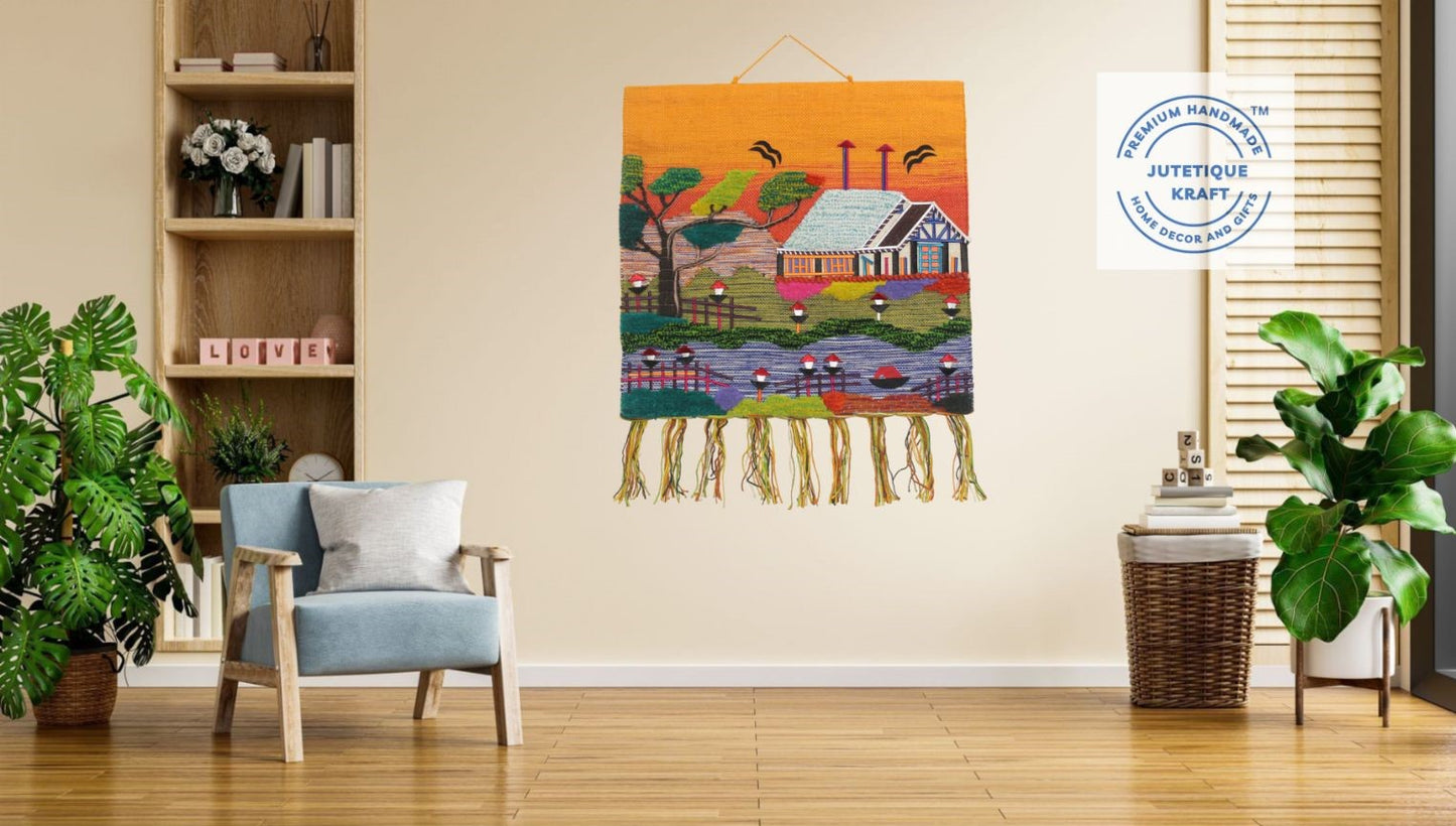 Large 30x30 handwoven jute village scenery tapestry hanging as an art piece above a living room sofa arrangement