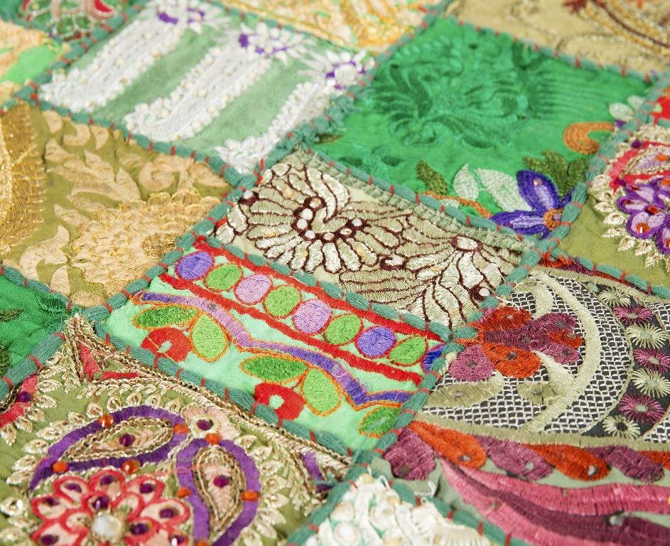 Vibrant handcrafted green patchwork table runner with bohemian textile patterns
