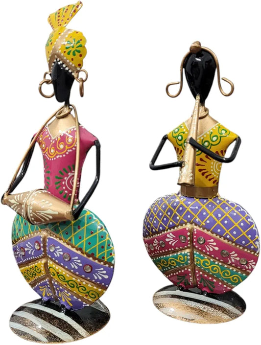 Colorful decorative figurines of dancers on a white background