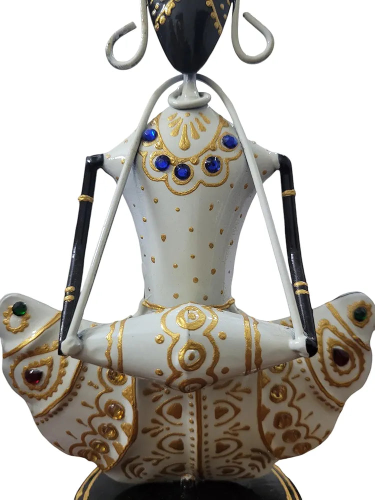 Decorative figurine of a person on a bird with intricate designs and colors.