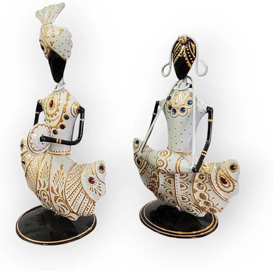 Decorative figurines with intricate designs on a white background