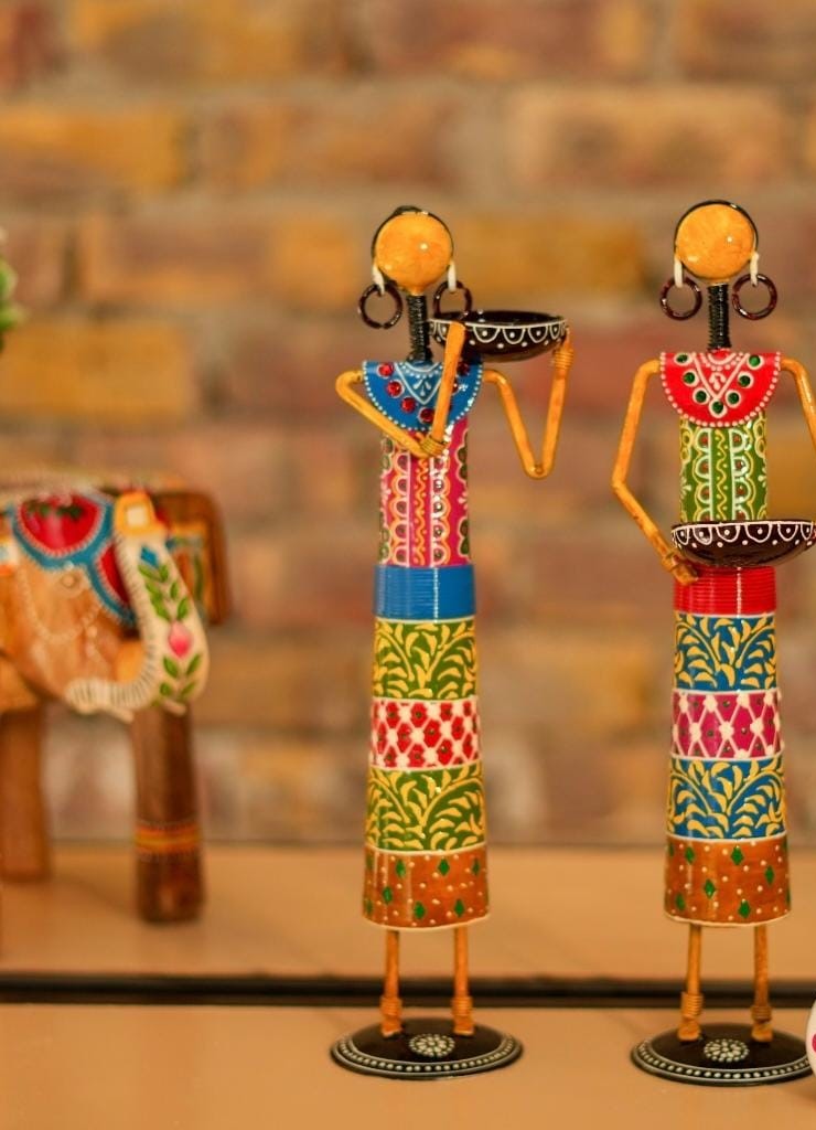 Colorful decorative figurines with intricate patterns on a blurred background