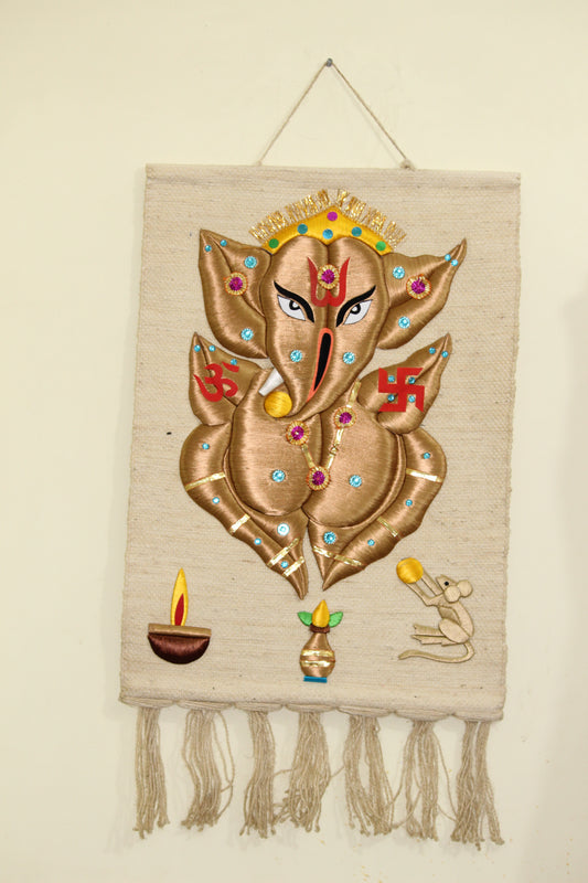 Decorative wall hanging with intricate designs and tassels on a beige background