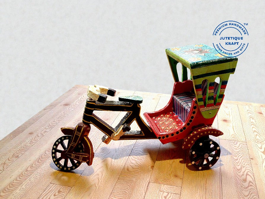 Handcrafted wooden Indian rickshaw model styled as a quirky centerpiece on a modern bohemian bookshelf