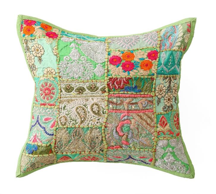 Decorative pillow with colorful patchwork design on a white background