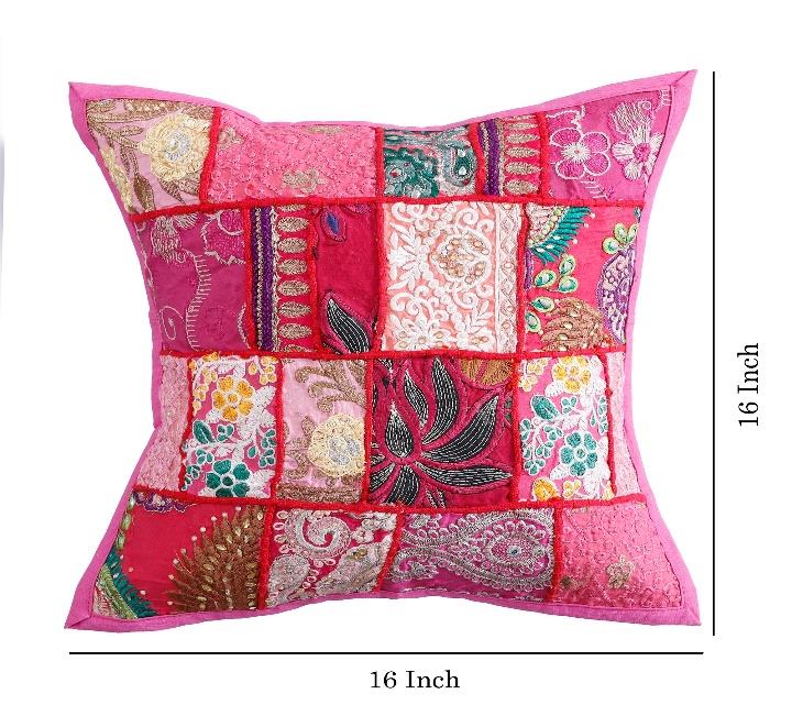 Decorative pillow with patchwork design on a white background