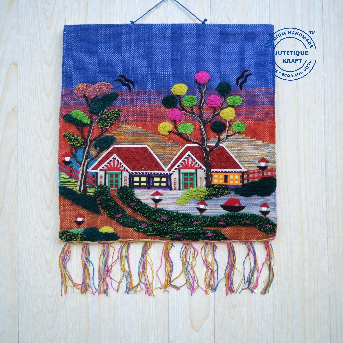 30x30 inch square GI Tagged Jute Woven Wall Hanging showing the Gramin Riverside Horizon design with a vibrant hand-dyed blue sky backdrop by Jutetique Kraft.