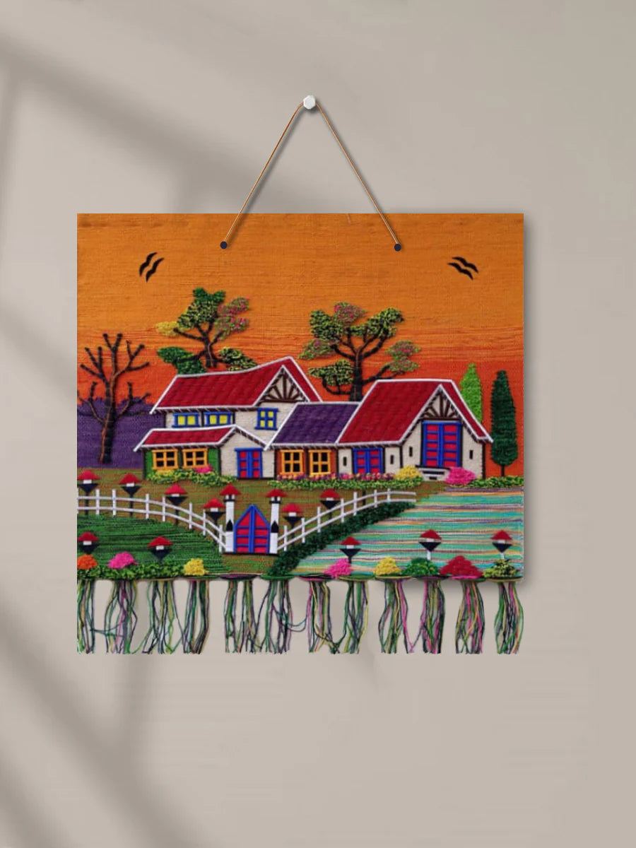 40x36 inch GI Tagged Jute Handwoven Wallhanging showcasing an intricate rural village scenery design by Jutetique Kraft