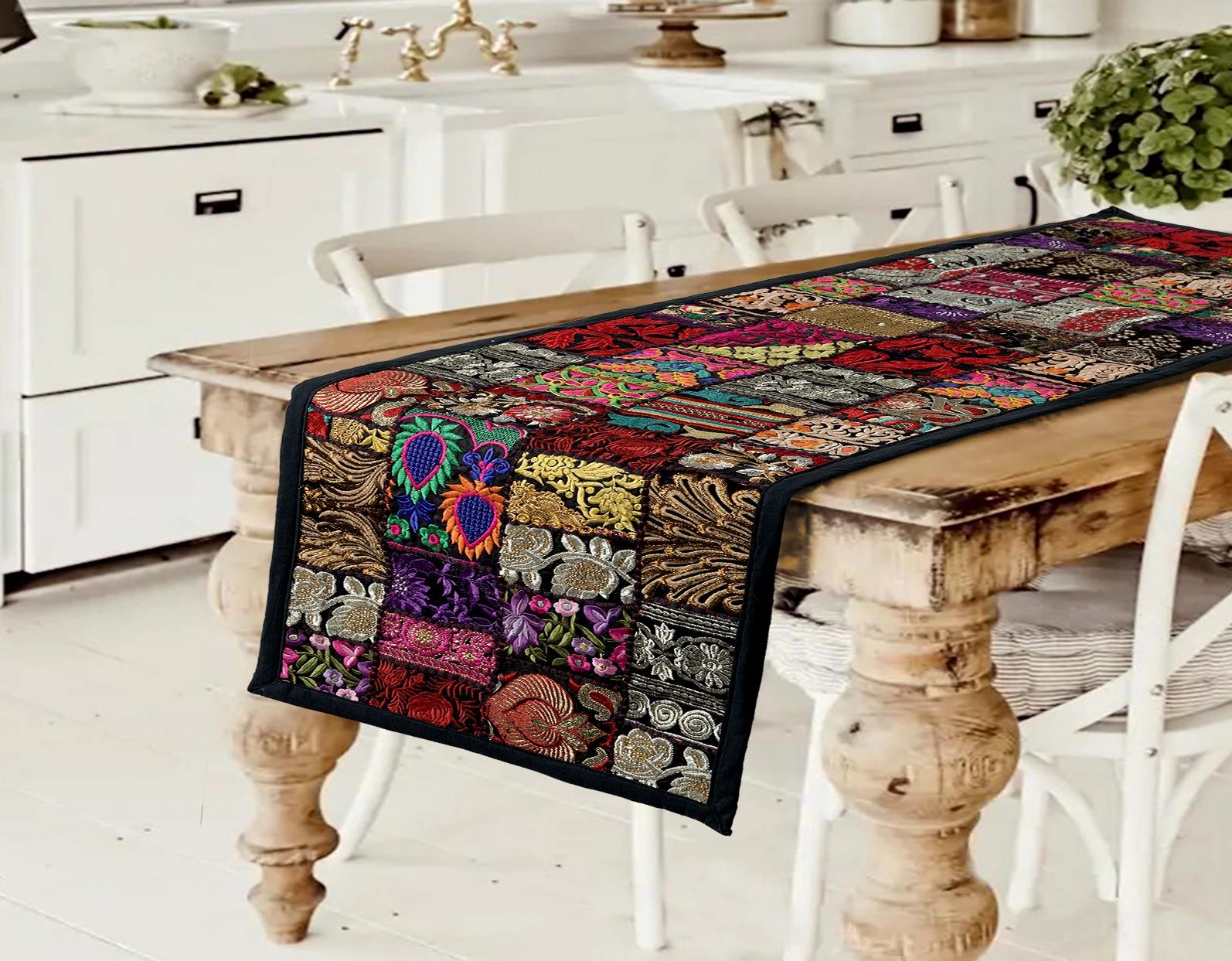 Modern black handcrafted patchwork table runner with rich contrasting textile art
