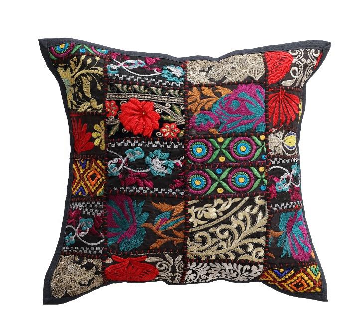 Decorative pillow with colorful embroidered patterns on a white background