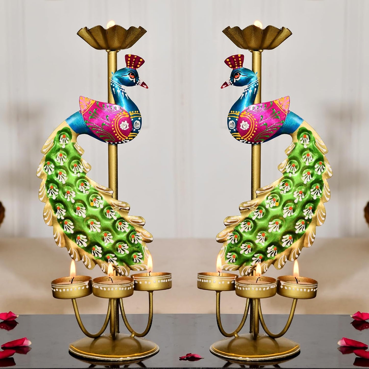 Pair of handcrafted colorful peacock-shaped metal candle holders from The Shriya Collection