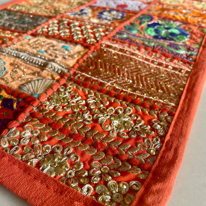 Festive orange handcrafted patchwork dining mats set for home decoration