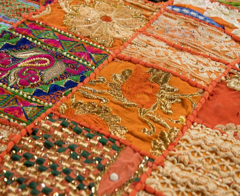 Vibrant festive orange handcrafted patchwork table runner for home decoration