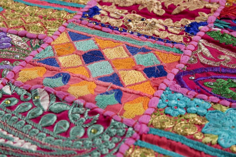 Handcrafted pink patchwork table runner with traditional block print textures