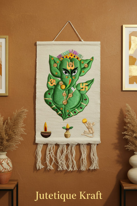 White Handmade Ganesh Ji Wall Hanging with intricate silk thread embroidery and tassels on a natural jute background