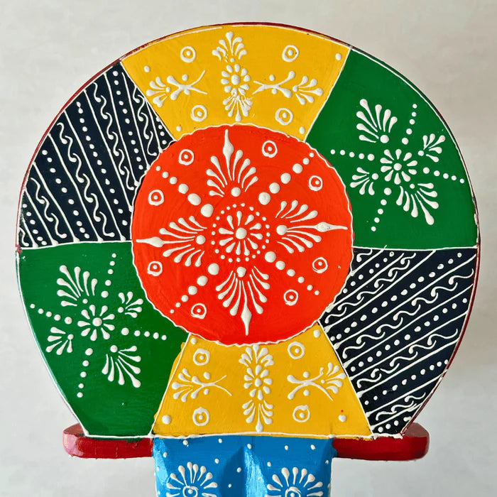 Top view of handpainted wooden elephant stool showcasing colorful traditional Indian motifs