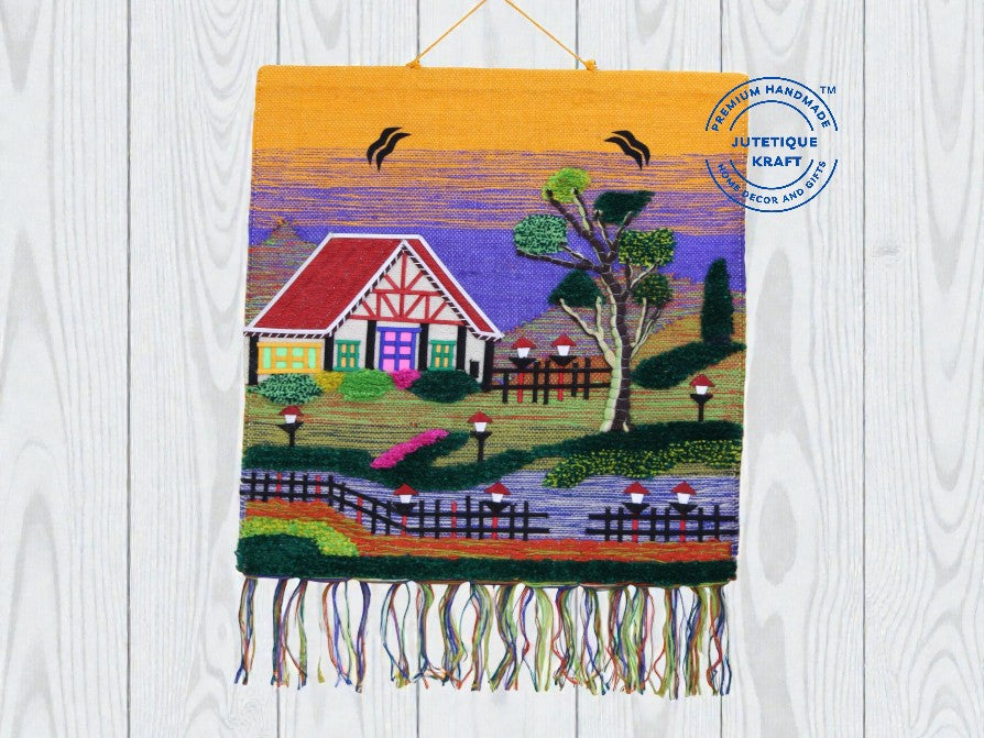 Traditional handwoven Ghazipur jute landscape tapestry featuring a thatched hut under a bright yellow sky