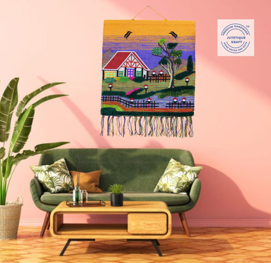 Traditional handwoven Ghazipur jute landscape tapestry featuring a thatched hut under a bright yellow sky
