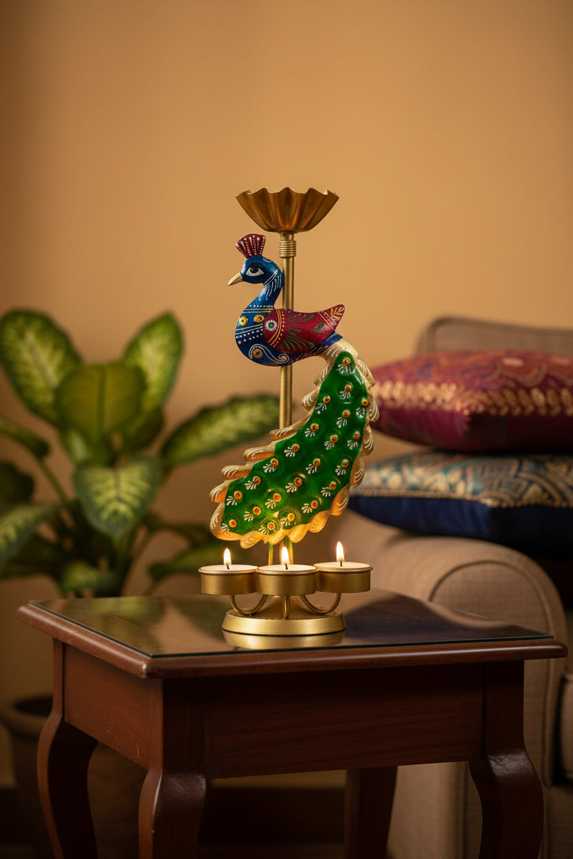 Handcrafted metal peacock candle stand featuring intricate detailing on a wooden side table with lit candles.