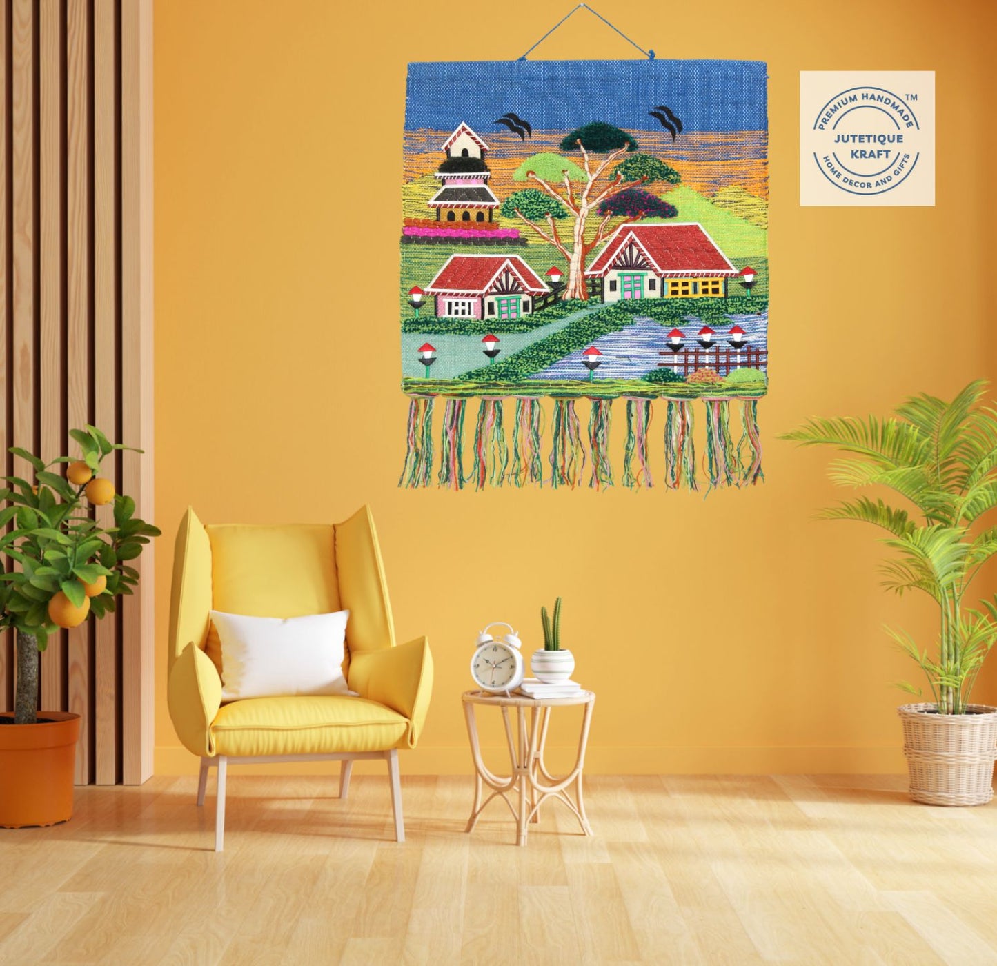 Earthy natural fiber spiritual wall hanging depicting a sacred countryside temple beneath a vibrant blue sky