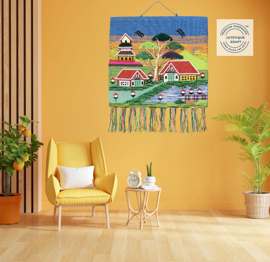 Earthy natural fiber spiritual wall hanging depicting a sacred countryside temple beneath a vibrant blue sky