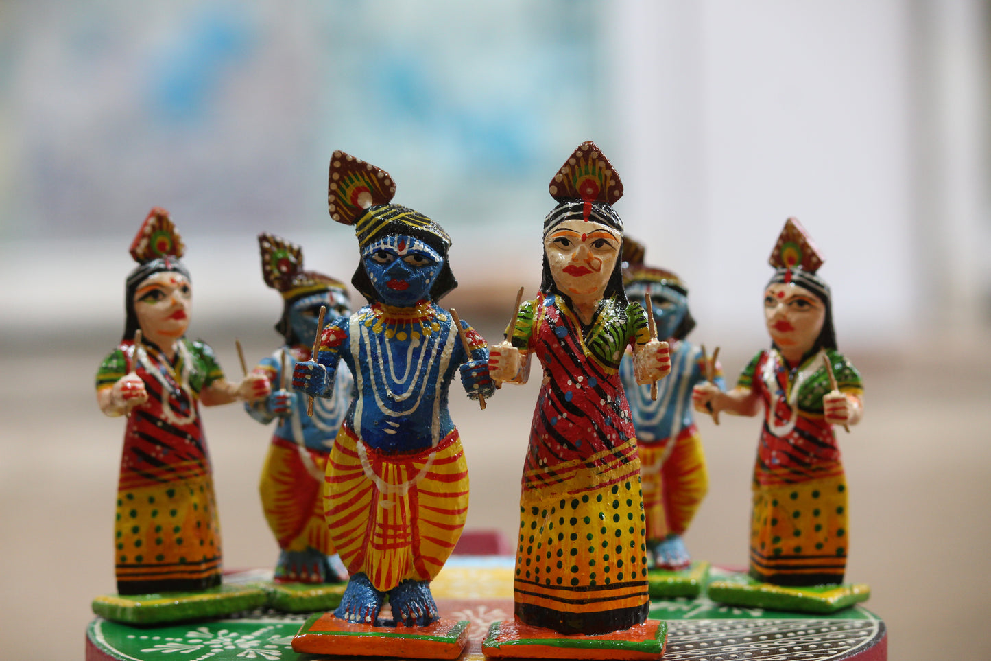 Eco-friendly handcrafted spiritual home decor showcasing traditional Indian wooden Raas Leela figurines.