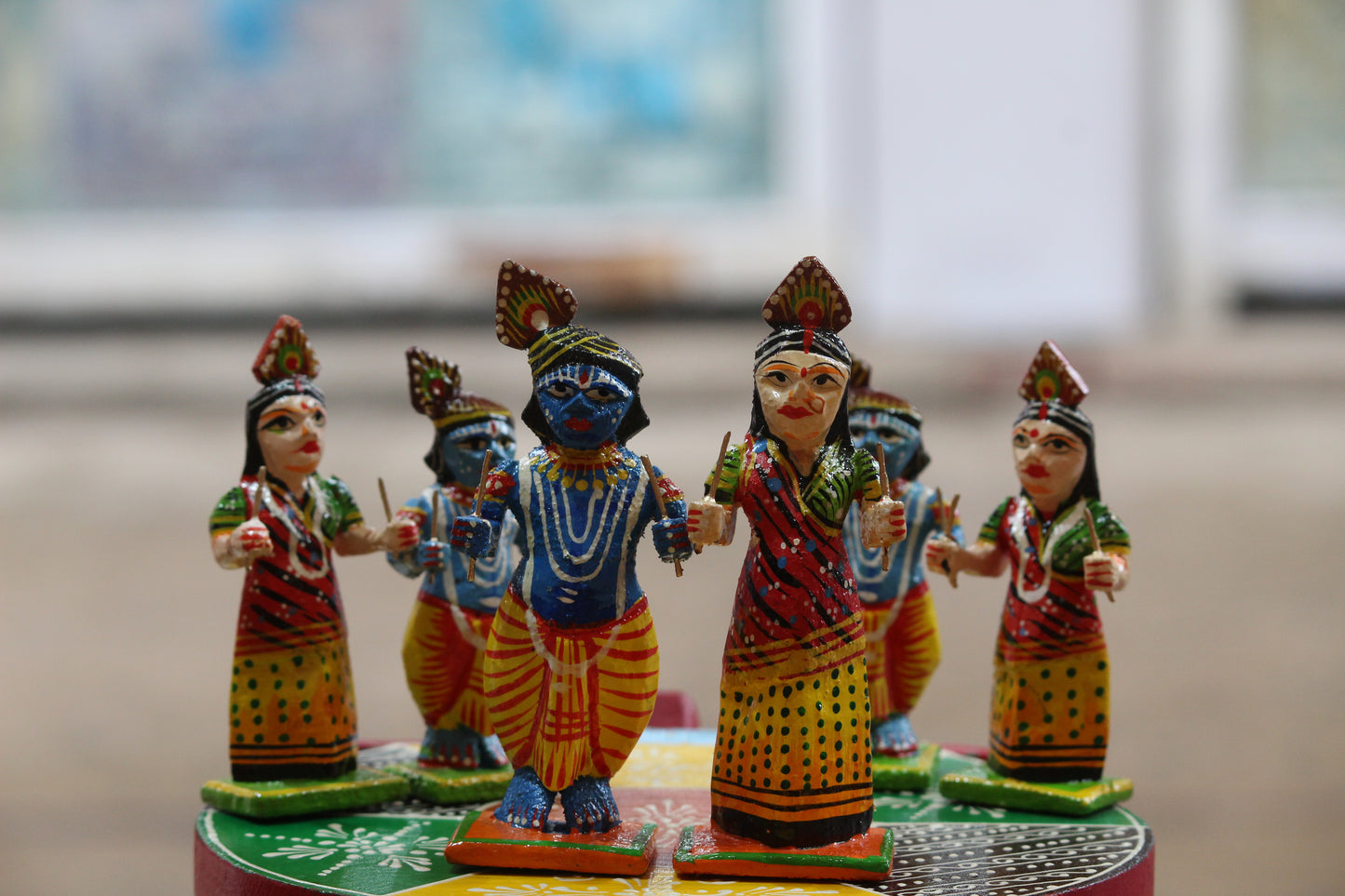 Detailed hand-painted lacquer finish on authentic Banaras wooden idols of Lord Krishna and Radha.