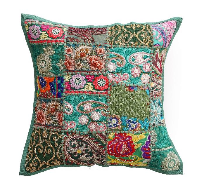 Decorative pillow with colorful patchwork design on a white background