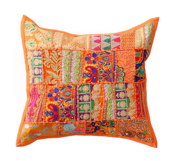 Colorful embroidered pillow with intricate patterns on a white background