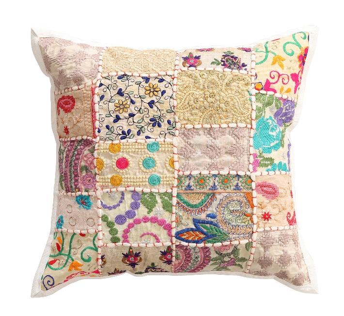 Decorative pillow with patchwork design on a white background
