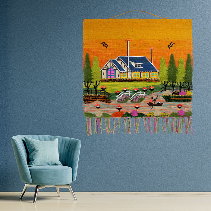 Handwoven Ghazipur rural village scenery jute wall hanging featuring a vibrant yellow sky accent