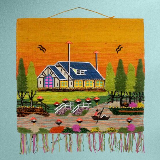 Handwoven Ghazipur rural village scenery jute wall hanging featuring a vibrant yellow sky accent