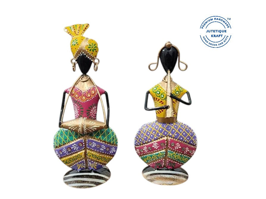 Artisanal metal musician couple figurines with detailed multi-colored traditional patterns