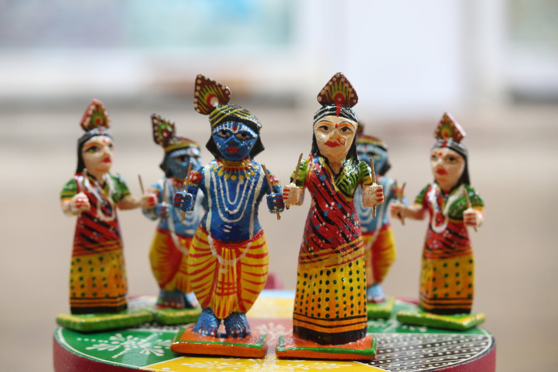 GI Tagged Varanasi wooden Radha Krishna Raas Leela statues handcrafted in traditional Kashi lacquerware style.