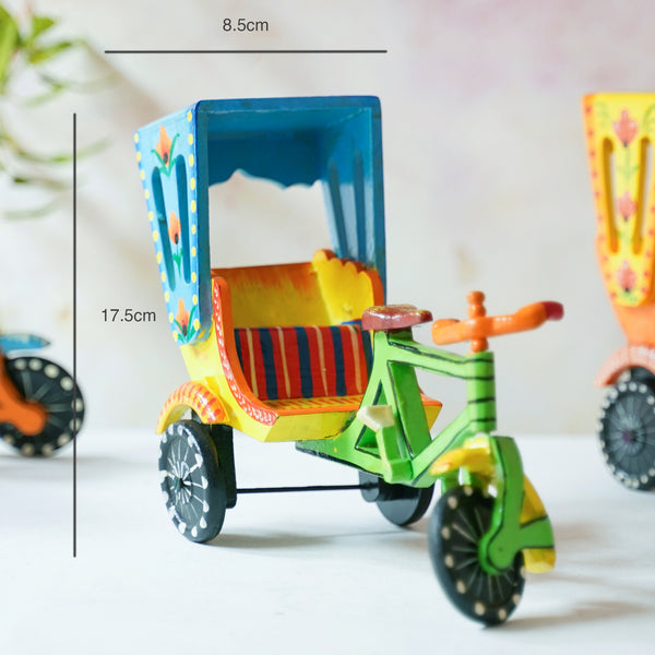Medium 6-inch and Big 10-inch sizes of traditional wooden rickshaw figurines side-by-side to show scale